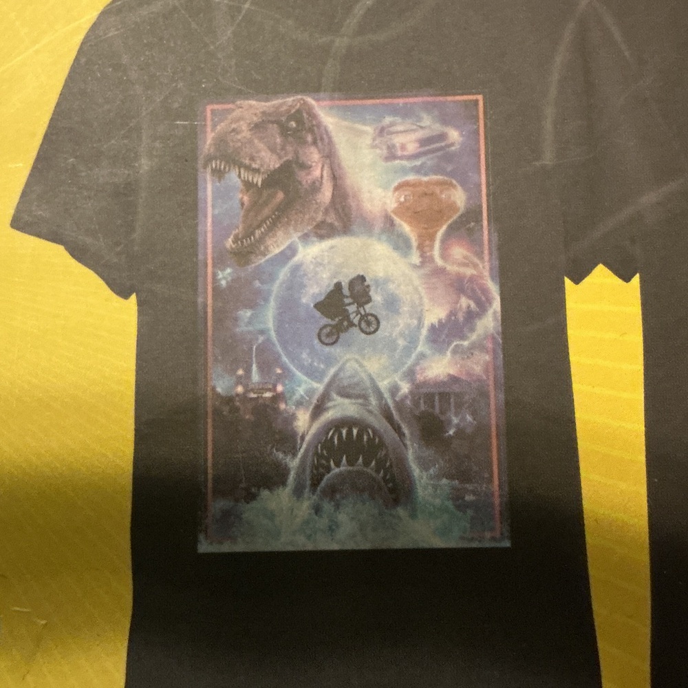 Universal Black Tee with Iconic Movie Collage